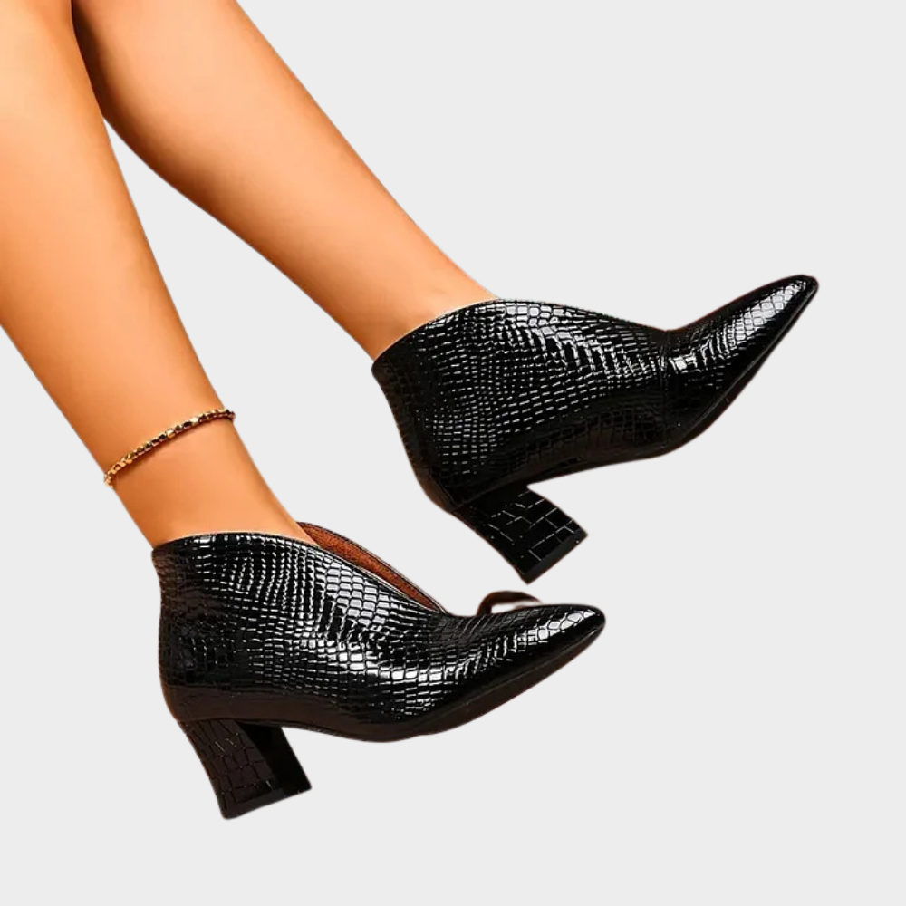 Black V-cut ankle boots with textured surface and mid-height block heel