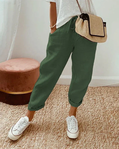 Green retro-style pants with relaxed fit and cuffed ankle hem