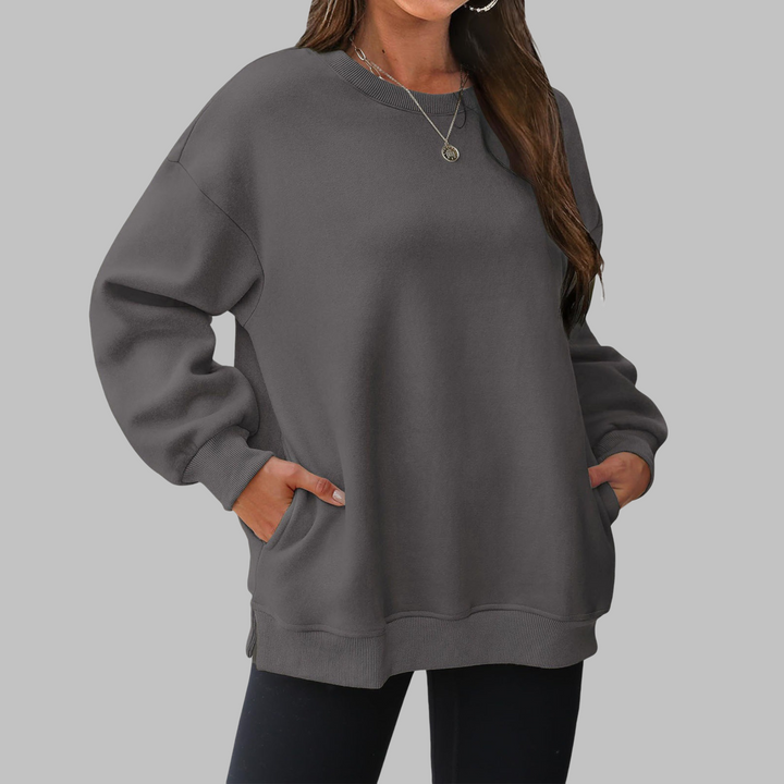 Dark gray oversized crewneck long sleeve sweater with ribbed cuffs and hem