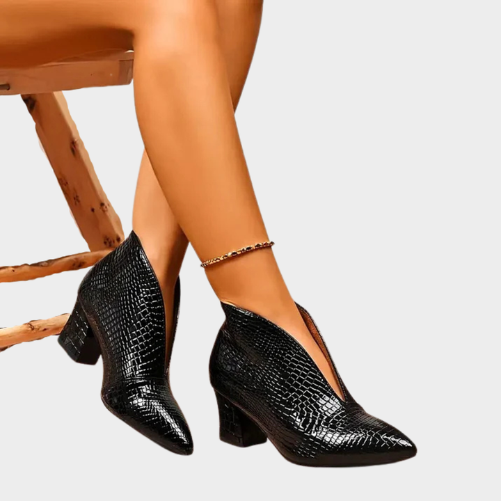 Black V-cut ankle boots with textured shine and block heel