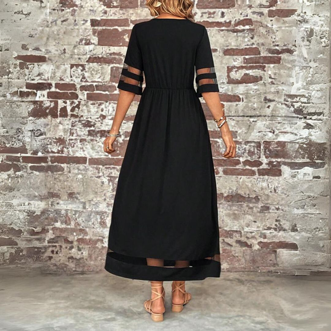 Black maxi dress back view with tiered waist and banded sleeve cutouts