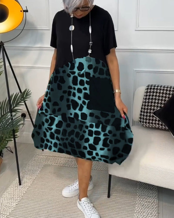 Women’s midi dress with black short-sleeve top and green leopard-print skirt, A-line