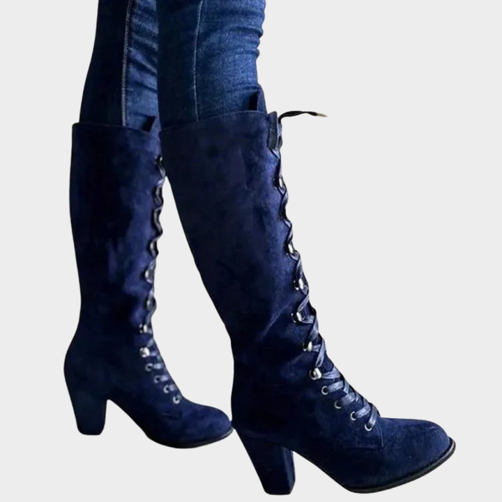 Dark blue suede lace-up high heel boots, side view with lace-up shaft.