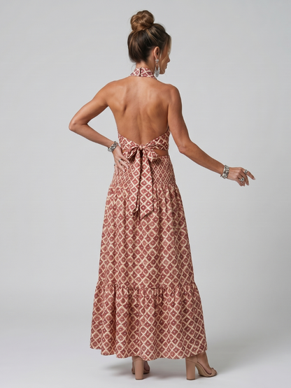 Dusty rose geometric print halter midi dress with low open back and tied waist bow