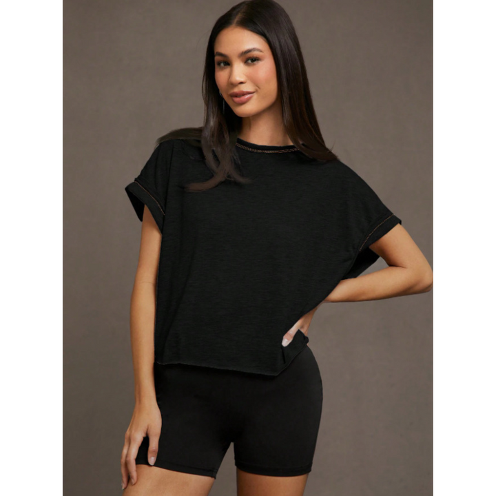 Black women’s cut out hemline short-sleeve top, crew neck, relaxed drape