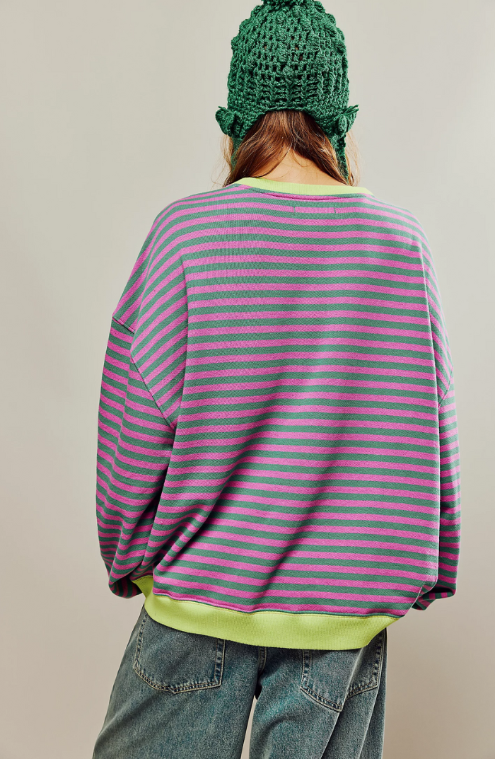 Striped sweater with green and purple horizontal stripes, ribbed cuffs and hem