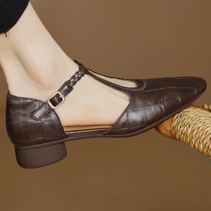 Brown leather Mary Jane back view with ankle strap and square metal buckle