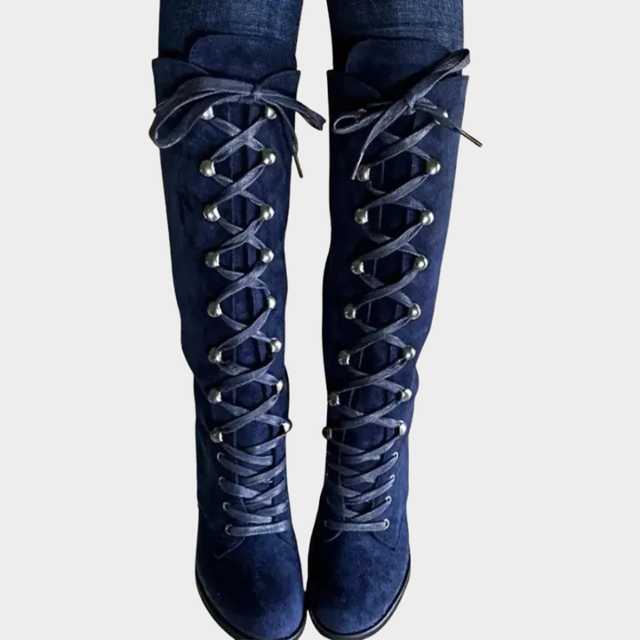 Blue suede lace-up high heel boots, back view with crisscross laces and block heel.