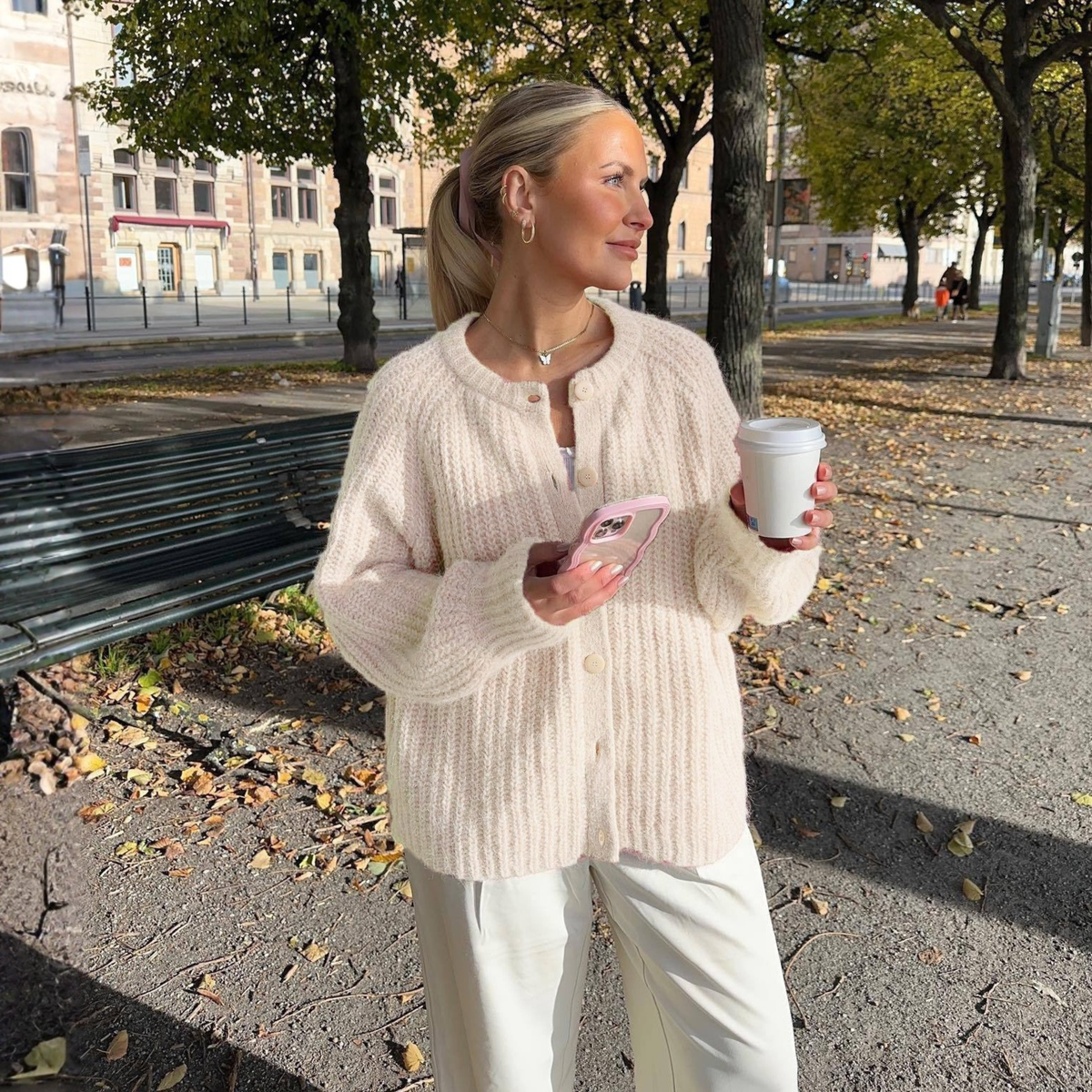 Cream button-front round-neck long-sleeve knit cardigan with textured ribbing