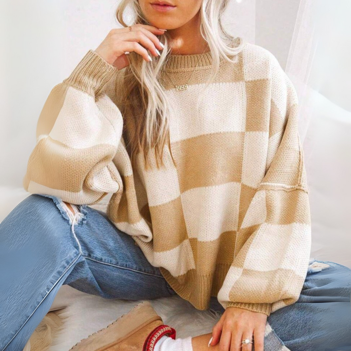Beige and white checkered crewneck long-sleeve knit sweater with ribbed cuffs