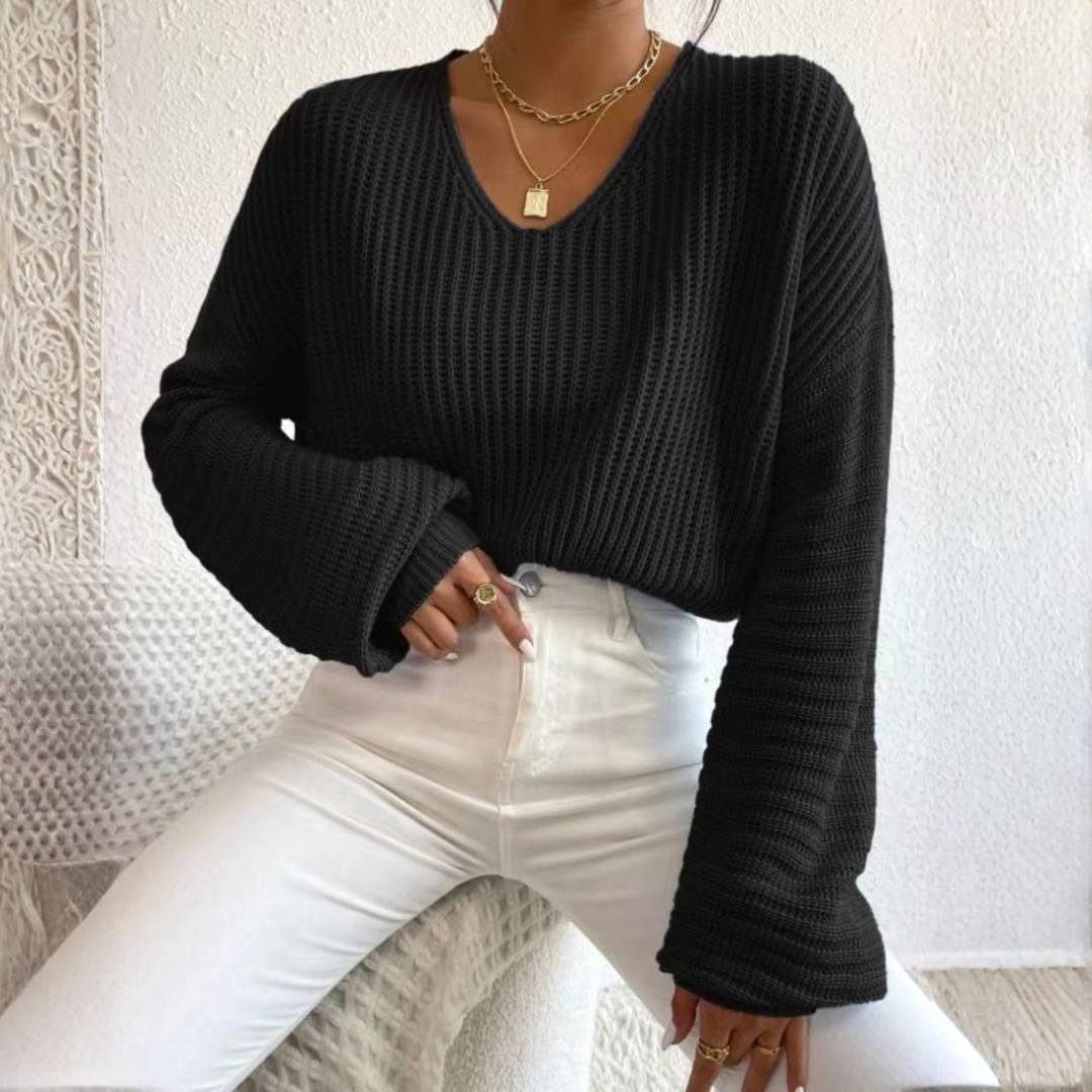 Black knit V-neck long-sleeve sweater with ribbed cuffs and textured stitch