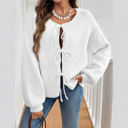 White tie-front cardigan with round neck and drawstring lacing, long sleeves
