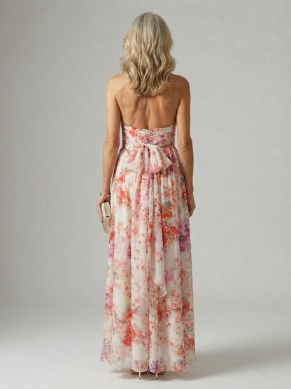 Back view floral maxi dress with halter tie, open back detail, flowing skirt