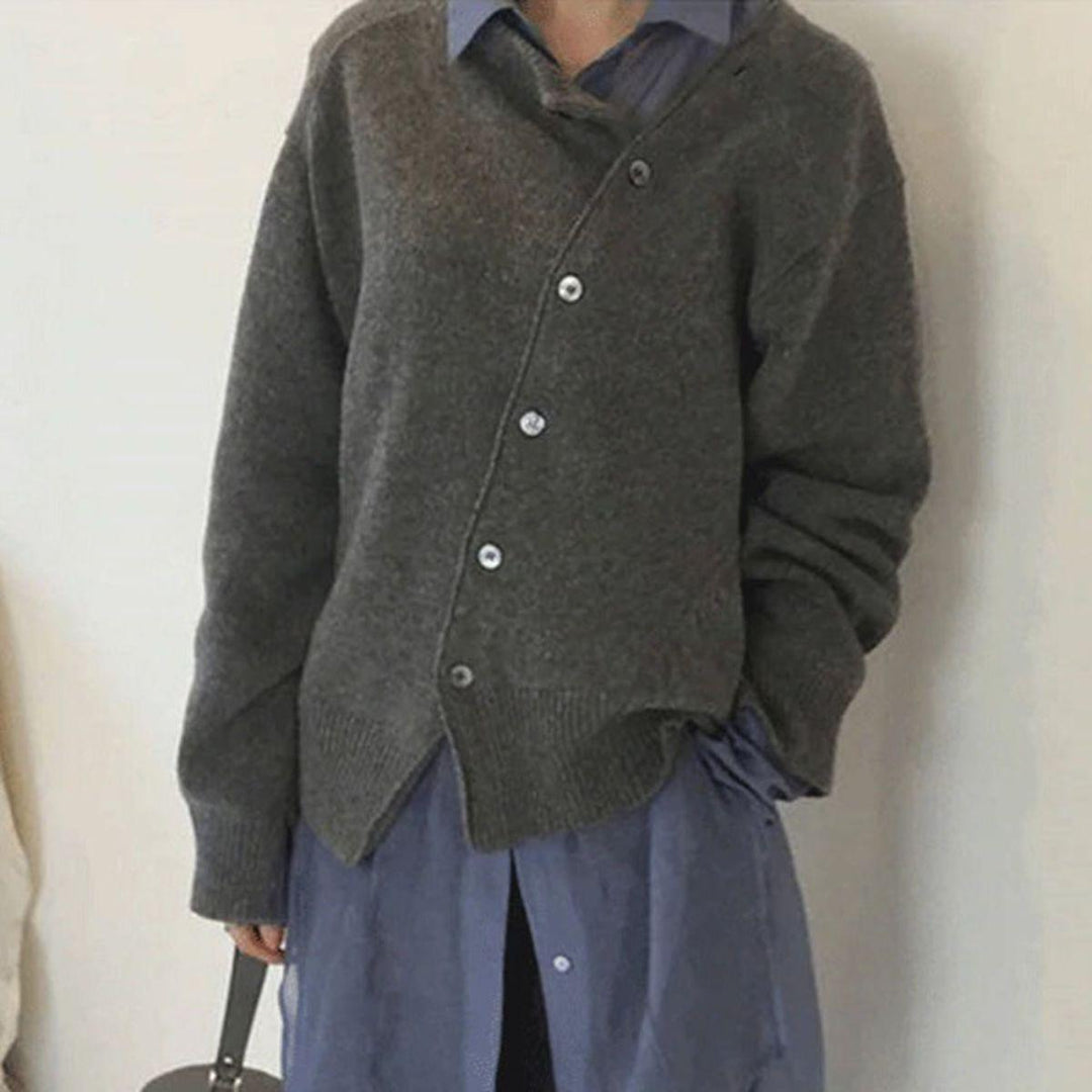 Gray asymmetric button cardigan with angled button placket and ribbed hem