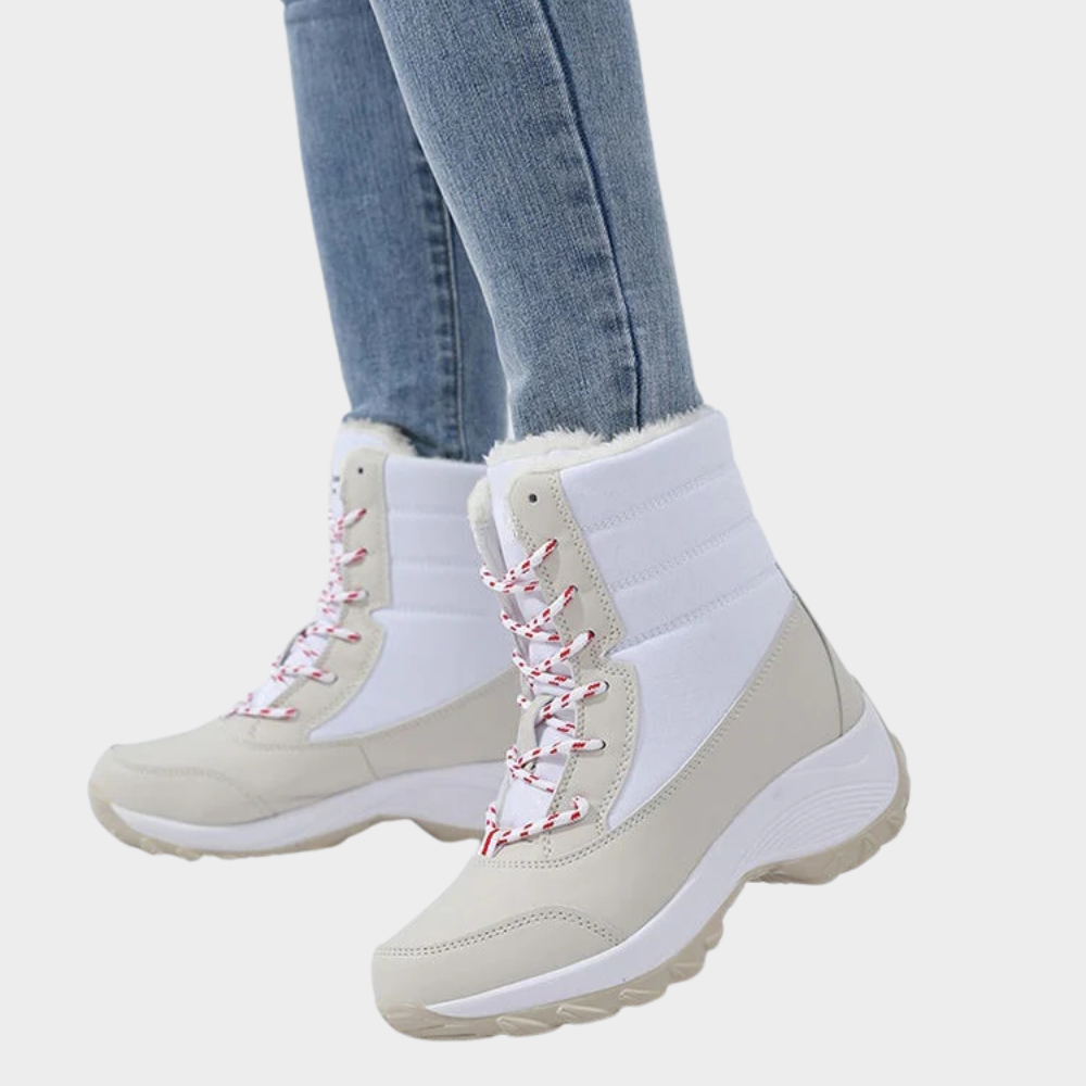 Cream winter boots with lace-up front, white faux-fur trim, and thick rubber tread sole.