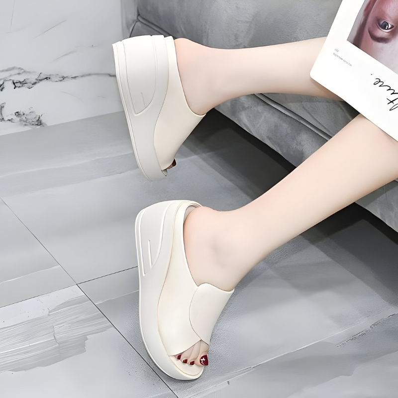Beige orthopedic sandals with open toe and curved wide strap on platform