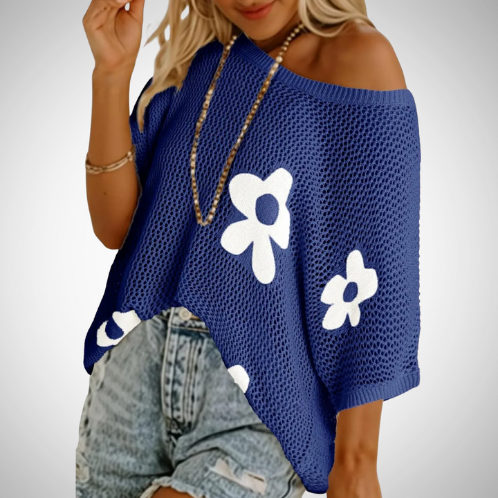 Blue off-shoulder crochet top with flower appliques and wide knit hem