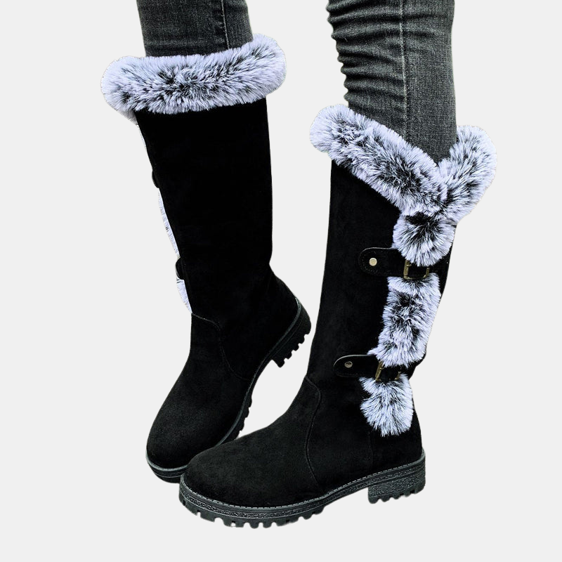 Black mid-calf boots with light blue faux-fur cuff and double buckle strap details
