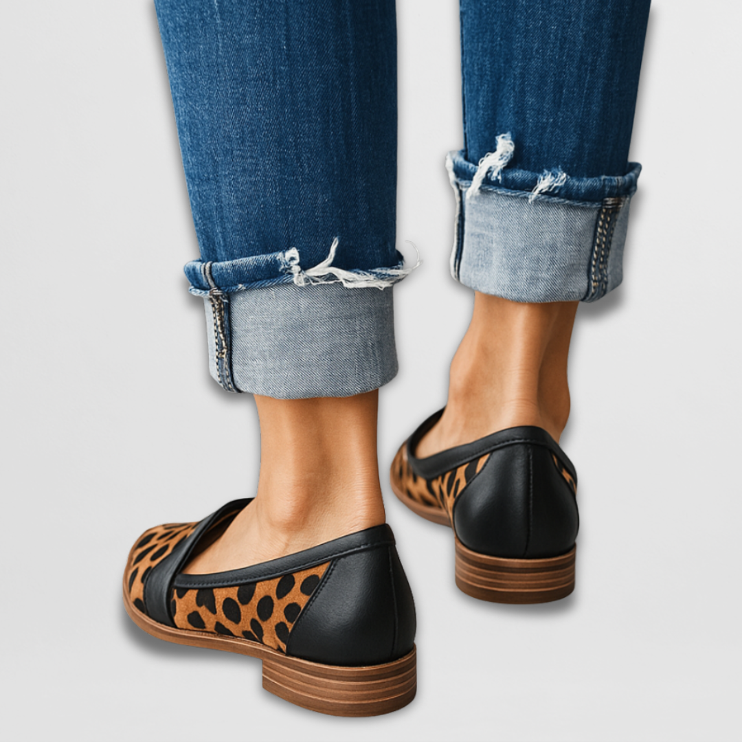 Black suede loafers with leopard-print panels and slip-on strap
