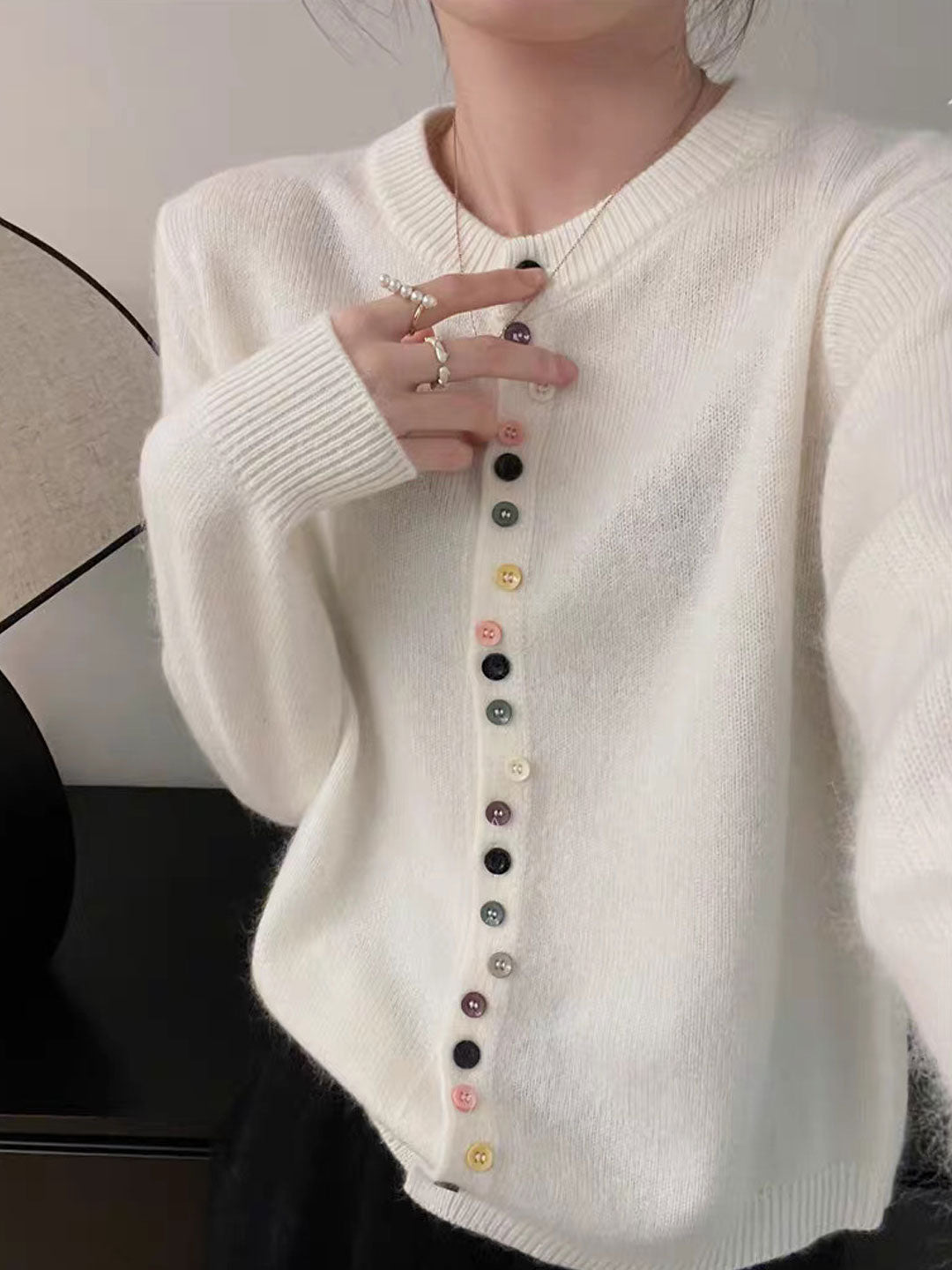 White knit cardigan with button front and ribbed crew neck, long sleeves