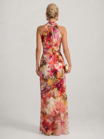 Back view of floral maxi dress with halter neck and open, sleeveless back