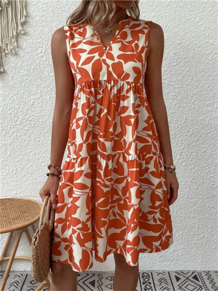 Orange leaf-print sleeveless V-neck flowy dress with gathered tiered skirt