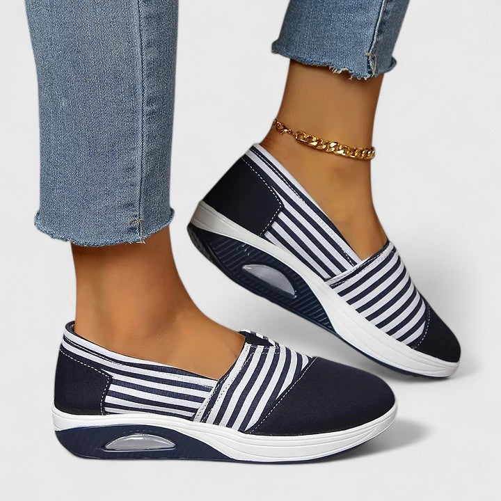 Anika orthopedic slip-on sneakers, navy upper with vertical white stripes and oval sole window