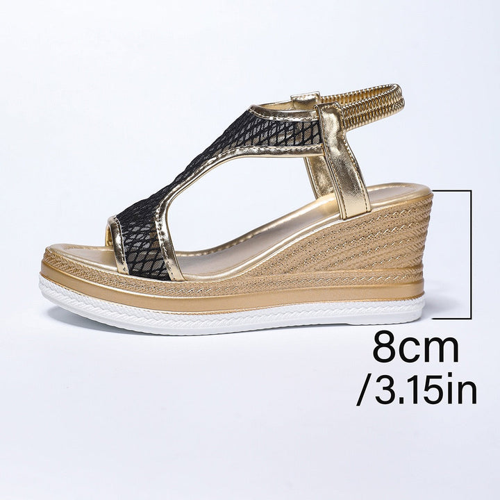Dark mesh wedge sandals with gold T-strap and textured platform midsole
