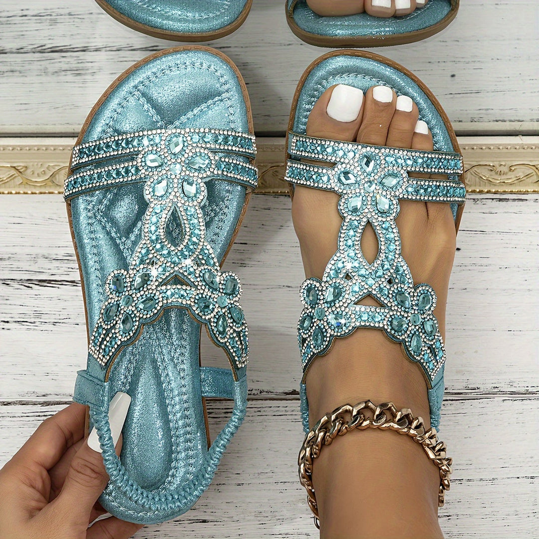Teal orthopedic crystal sandals with rhinestone detailing on front and toe straps.
