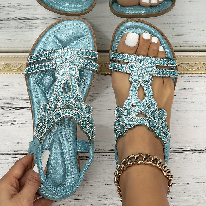 Teal orthopedic crystal sandals with rhinestone detailing on front and toe straps.