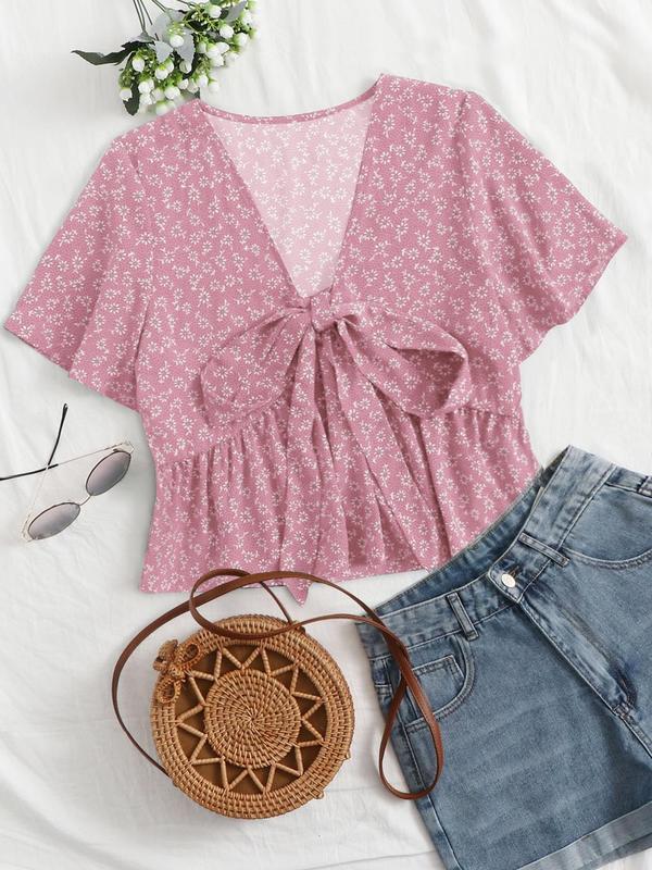 Pink floral v-neck flowy top with short sleeves and tied front detail