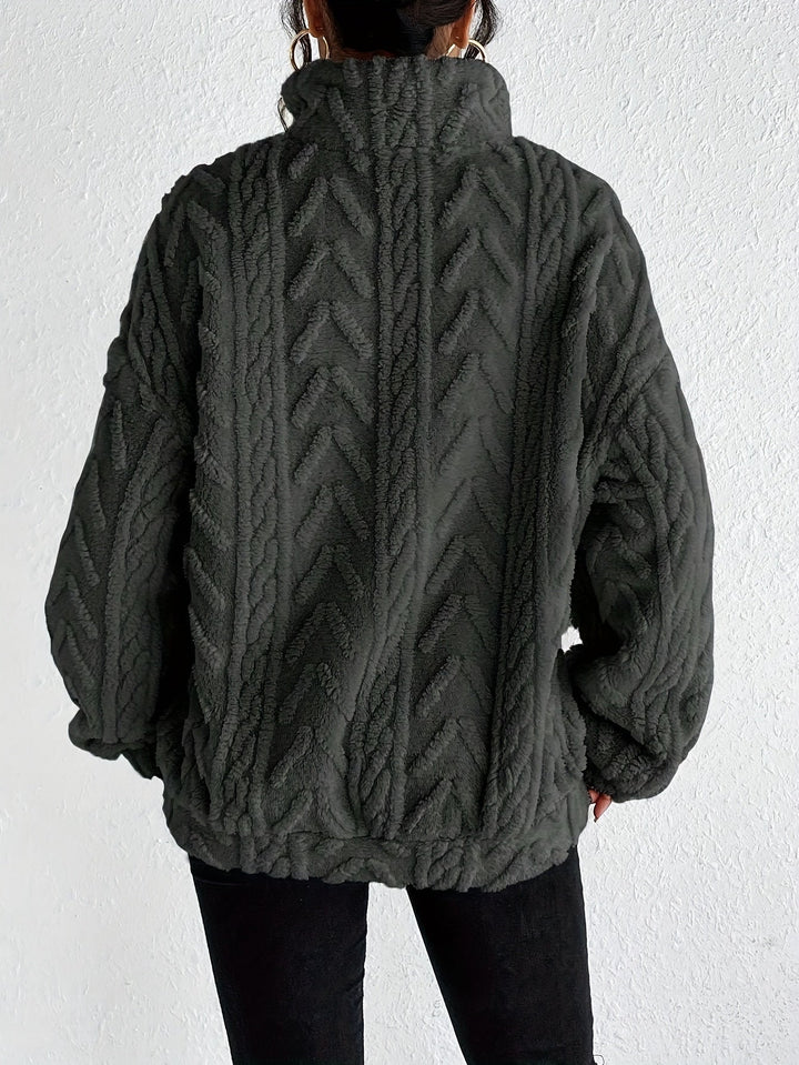 Warm knit quarter-zip sweater in dark gray, cable texture, long sleeves, back view.