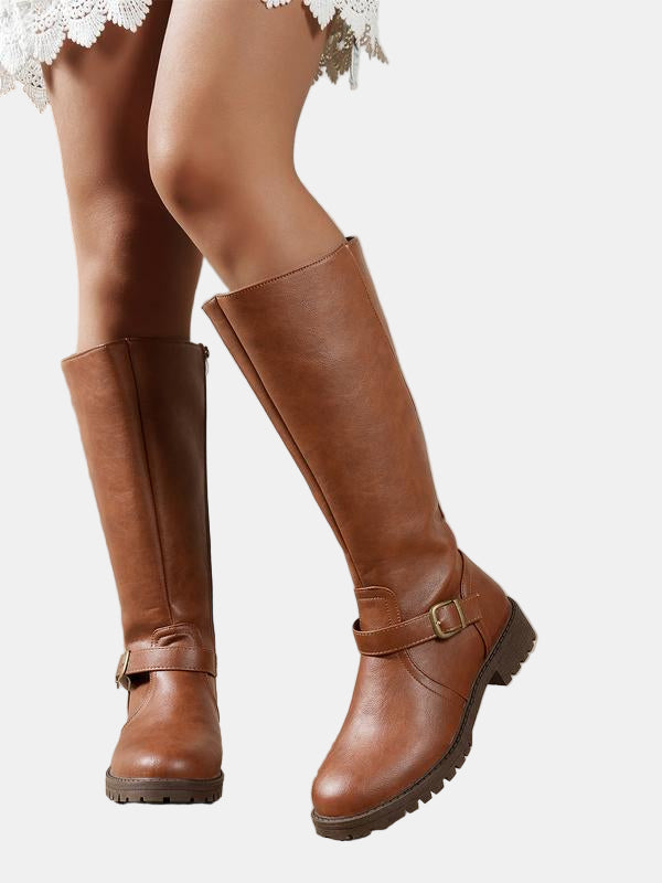 Brown leather low-heel boots with buckle strap and chunky lug sole