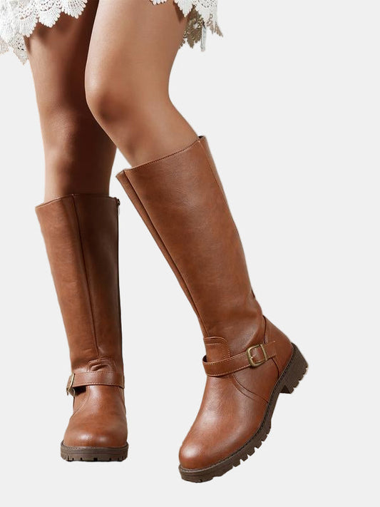 Brown leather low-heel boots with buckle strap and chunky lug sole