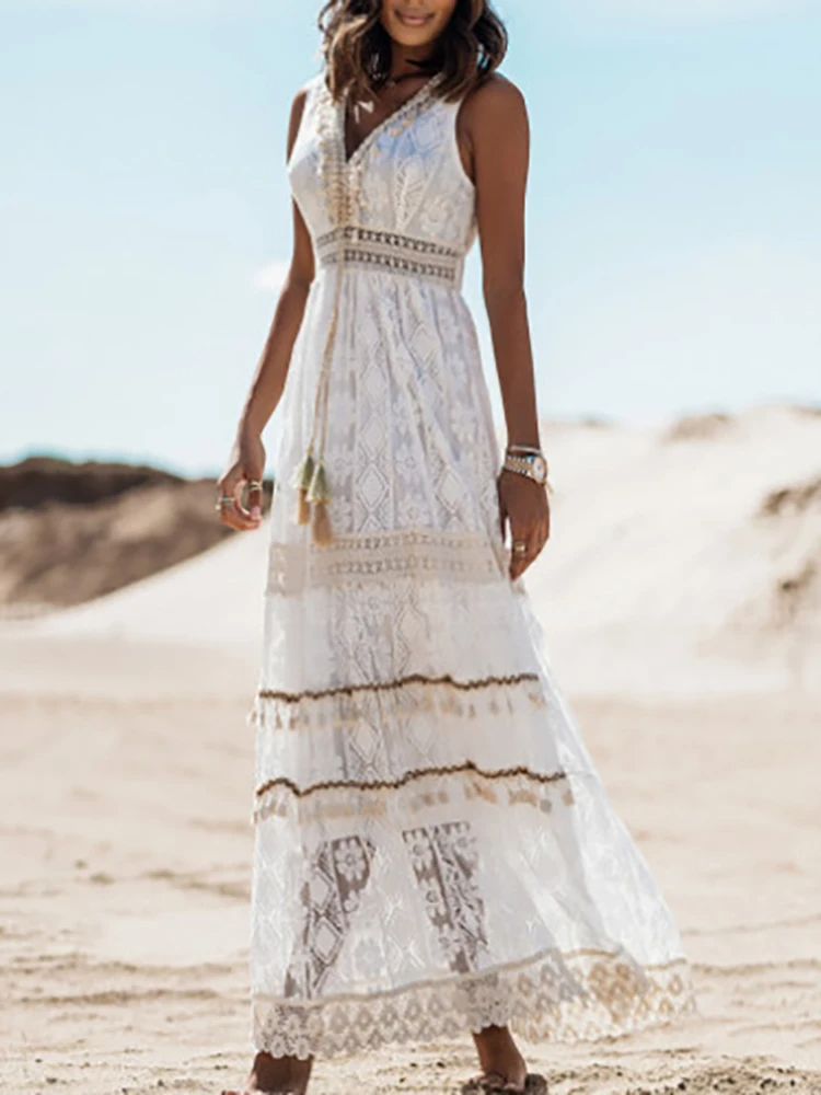 White boho sleeveless maxi dress with V-neck, lace tiers and fringe-trim hem