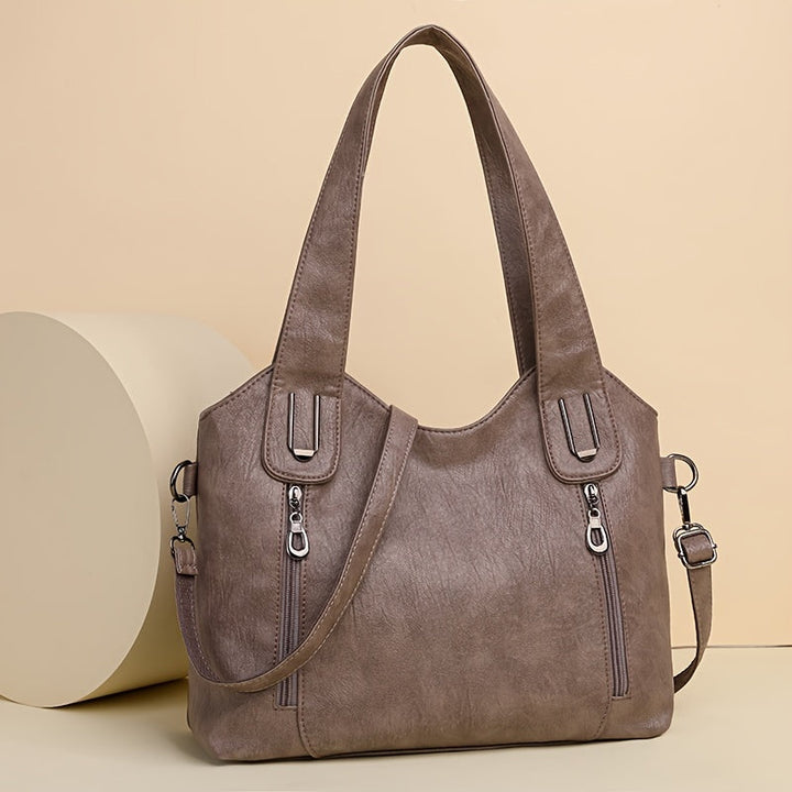 Lumi women’s classic tote bag in taupe with dual handles, top zip, and side zip pockets