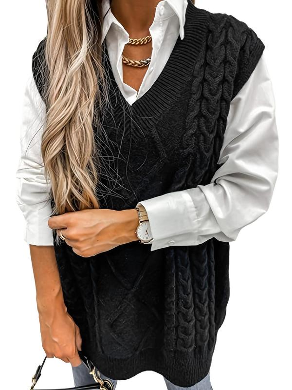 Black textured V-neck knit vest with cable pattern and ribbed hem trim
