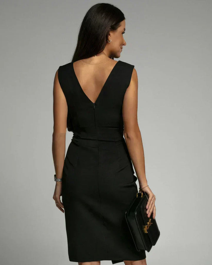 Black backless bodycon dress with V-back and fitted waist seam