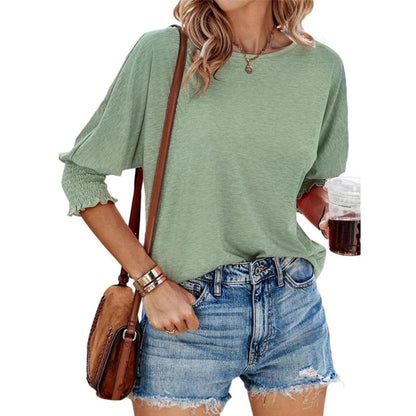 Light green lightweight short-sleeve blouse with gathered cuffs and relaxed fit