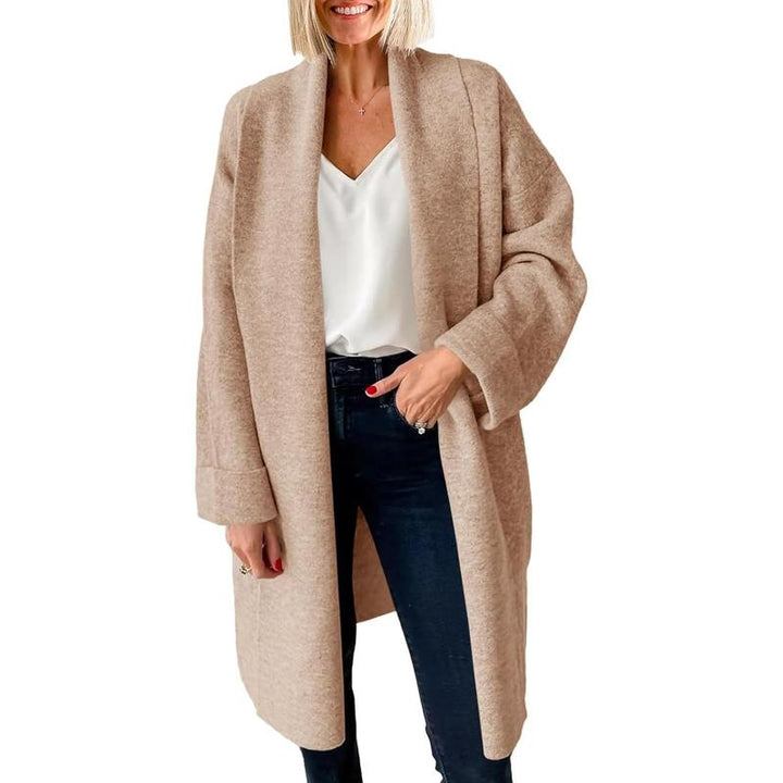 Light beige oversized long open-front cardigan, chunky knit with relaxed drape.