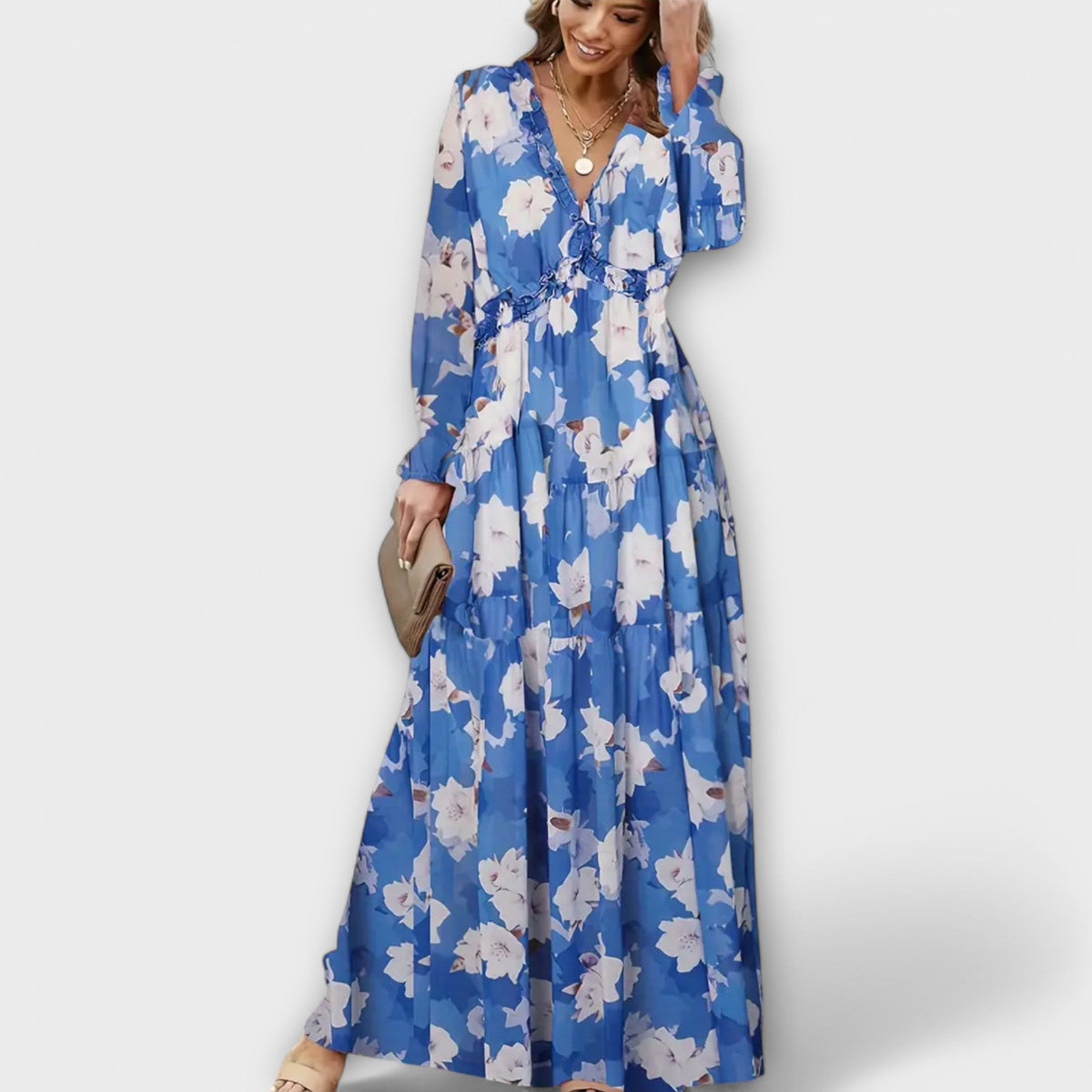 Floral maxi dress in blue with V-neck, long sleeves, tiered ruffle hem and cinched waist