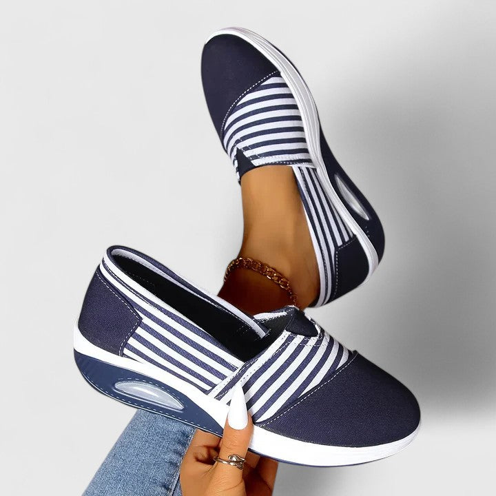 Anika orthopedic slip-on sneakers, navy with white striped straps and side oval cushioning window
