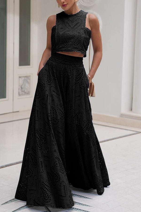 Black embroidered sleeveless crop top and high-waist maxi skirt set with lace-like texture