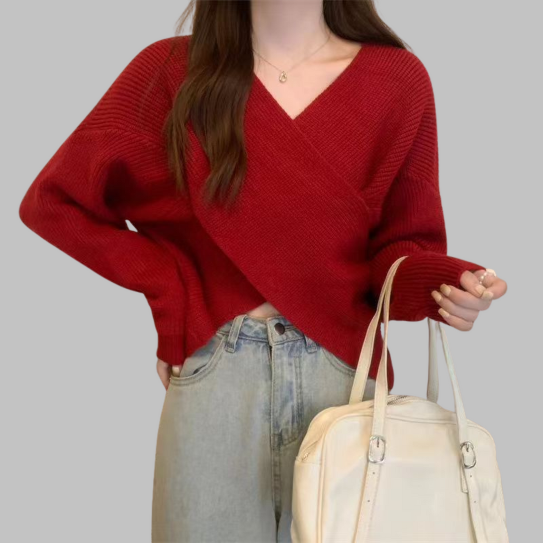 Red wrap-front V-neck sweater with long sleeves and ribbed knit texture