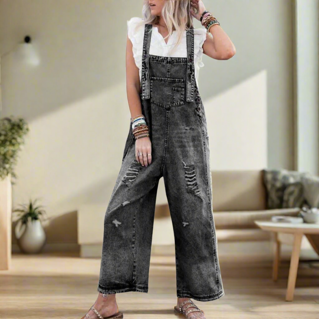 Vintage-wash denim adjustable jumpsuit, dark gray with bib pocket and distressed legs