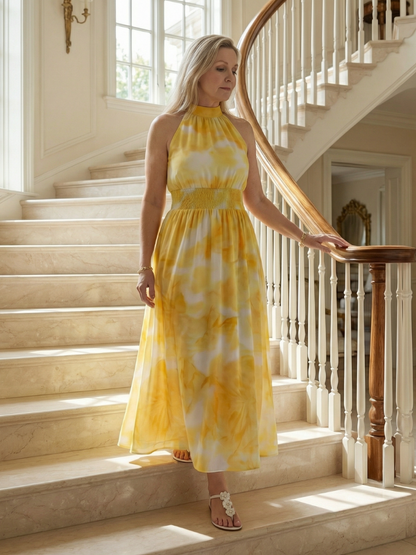 Gathered halter midi dress in yellow abstract print with smocked waist and halter neckline