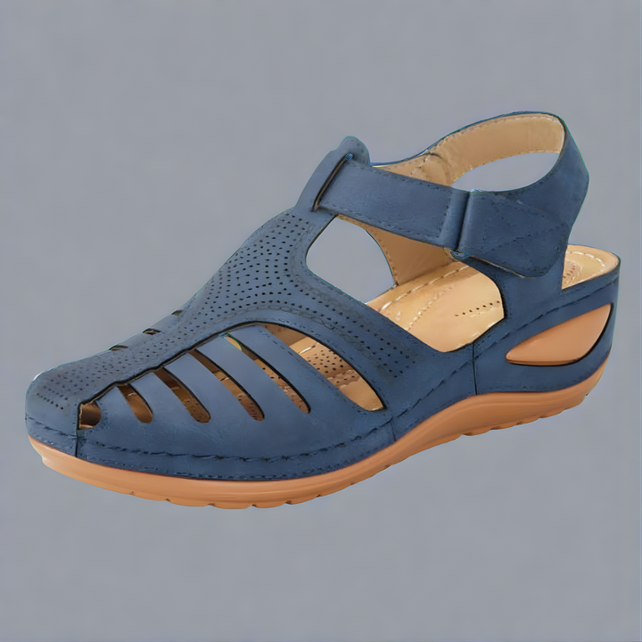 Orthopedic bunion corrector sandal, blue leather-look with perforations and wide hook strap.
