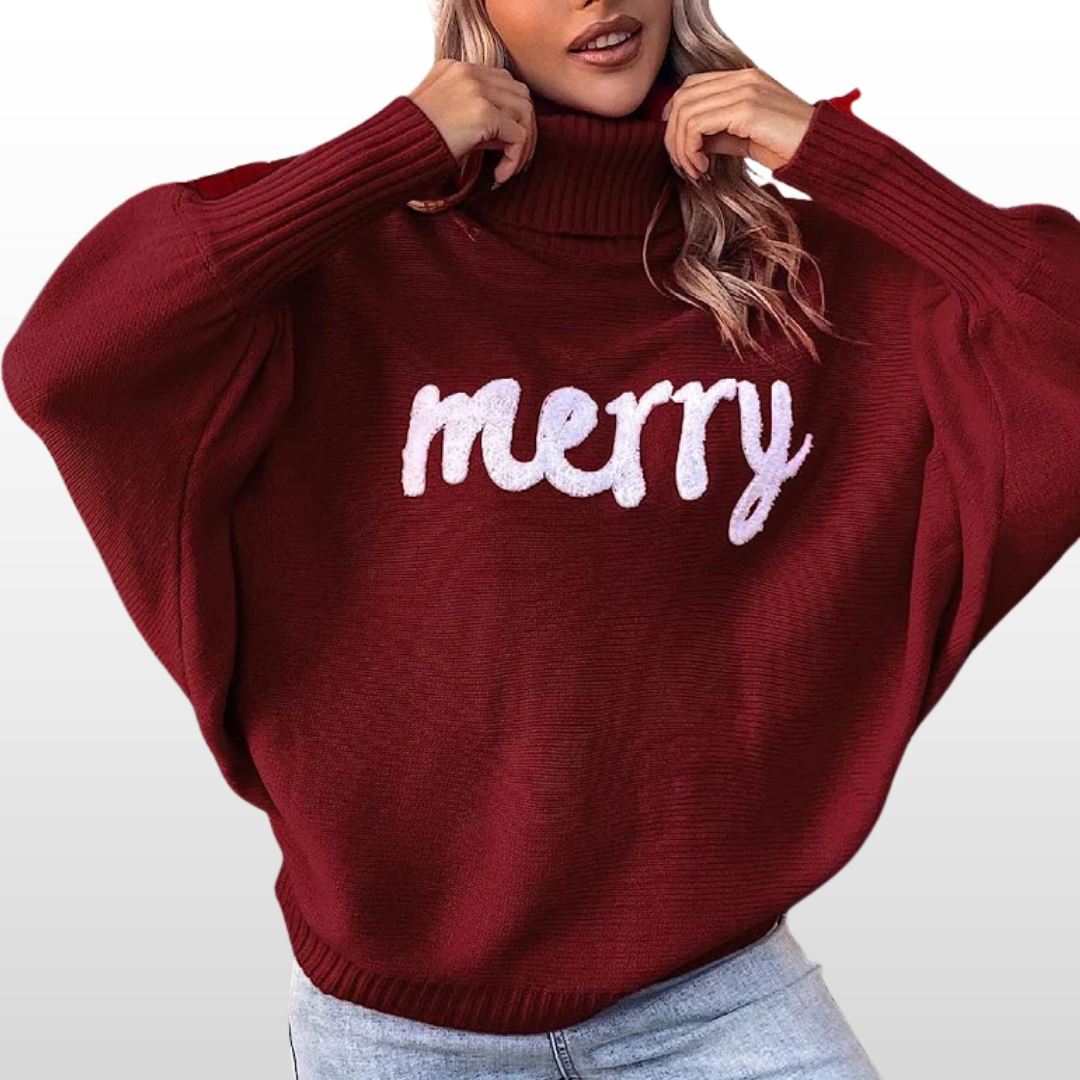 Burgundy knit turtleneck sweater with batwing sleeves and white “Merry” print