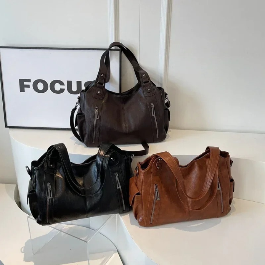 Dual zipper large capacity shoulder bag with top handles and side straps, in dark brown and black