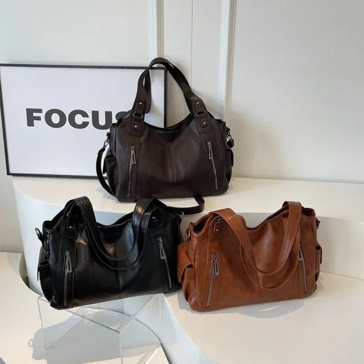 Dual zipper large capacity shoulder bag with top handles and side straps, in dark brown and black